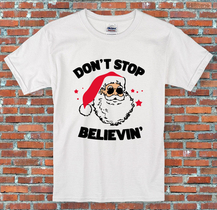 Don't stop Believin' Santa Claus Christmas Holiday Funny T-Shirt S-2XL